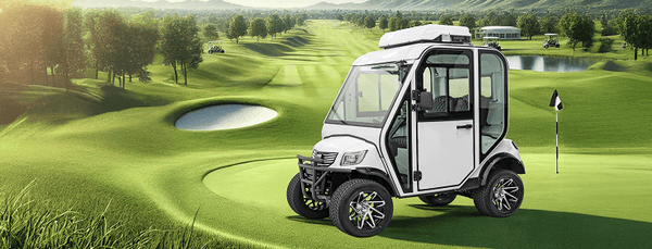 Golf cart on a golf course with green grass and trees in the background